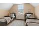 Comfortable bedroom featuring two beds and natural lighting from the window at 5250 Villa Lake Ct, Suwanee, GA 30024