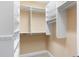 Organized walk-in closet with built-in shelving and rods, offering ample storage space at 5250 Villa Lake Ct, Suwanee, GA 30024
