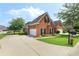 Well-maintained brick home with a driveway and an attached two-car garage at 5250 Villa Lake Ct, Suwanee, GA 30024