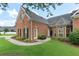 Attractive brick home with a walkway, landscaped front yard, and covered entryway at 5250 Villa Lake Ct, Suwanee, GA 30024