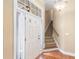 Inviting foyer with natural light, staircase, and hardwood floors, setting a welcoming tone at 5250 Villa Lake Ct, Suwanee, GA 30024