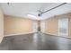 Spacious garage featuring neutral walls, painted concrete floor, and a back door to the yard at 5250 Villa Lake Ct, Suwanee, GA 30024