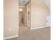 Bright hallway with neutral walls and carpeted floor, connecting various rooms in the home at 5250 Villa Lake Ct, Suwanee, GA 30024