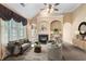 Inviting living room features a fireplace, built-in shelving, and ample seating at 5250 Villa Lake Ct, Suwanee, GA 30024