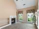 Living room featuring a fireplace, built-in shelves, and windows providing natural light at 5250 Villa Lake Ct, Suwanee, GA 30024