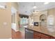 Open living room with granite island, fireplace, and large windows with natural light at 5250 Villa Lake Ct, Suwanee, GA 30024