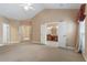 Spacious carpeted main bedroom with doors that lead to the main bathroom at 5250 Villa Lake Ct, Suwanee, GA 30024