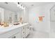 Bright bathroom featuring double sinks, modern fixtures, and a separate glass-enclosed shower at 771 Arbor Gate Ln, Lawrenceville, GA 30044