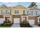 Charming two-story townhome with brick and siding accents and a one-car garage at 771 Arbor Gate Ln, Lawrenceville, GA 30044