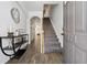 Inviting foyer with luxury vinyl plank flooring and stairs leading to the upper level at 771 Arbor Gate Ln, Lawrenceville, GA 30044
