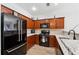 Well-equipped kitchen with granite countertops, stainless steel appliances, and wood cabinetry at 771 Arbor Gate Ln, Lawrenceville, GA 30044