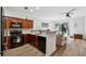 Modern kitchen overlooking the living room with granite countertops and stainless steel appliances at 771 Arbor Gate Ln, Lawrenceville, GA 30044