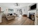 Bright living room with a fireplace, sliding doors, and hardwood-style floors at 771 Arbor Gate Ln, Lawrenceville, GA 30044