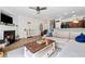 Open-concept living room featuring a fireplace, recessed lighting, and access to the kitchen at 771 Arbor Gate Ln, Lawrenceville, GA 30044