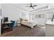 Serene primary bedroom featuring a tray ceiling, a ceiling fan, and plush carpeting at 771 Arbor Gate Ln, Lawrenceville, GA 30044