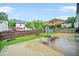 Spacious backyard featuring a concrete patio, storage shed, mature trees, and privacy fence at 773 Minor Oaks Nw Run, Lilburn, GA 30047