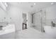 Beautiful bathroom with marble floors, glass shower, soaking tub, and double sink vanity at 773 Minor Oaks Nw Run, Lilburn, GA 30047