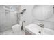 Bathroom features a glass shower, a modern sink, and a circular mirror at 773 Minor Oaks Nw Run, Lilburn, GA 30047