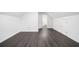 An attic bedroom shows wood-look floors and access to a bathroom at 773 Minor Oaks Nw Run, Lilburn, GA 30047