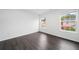 Bright bedroom with dark wood grain flooring and two large windows at 773 Minor Oaks Nw Run, Lilburn, GA 30047
