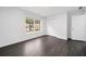 Bedroom with hardwood floor, window, closet, and door at 773 Minor Oaks Nw Run, Lilburn, GA 30047