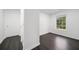 Light-filled room with door, window, and dark hardwood floor at 773 Minor Oaks Nw Run, Lilburn, GA 30047