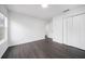 Bedroom with neutral paint, wood floors, one window, and white trim at 773 Minor Oaks Nw Run, Lilburn, GA 30047