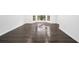 Bright room with large windows and shiny hardwood floor at 773 Minor Oaks Nw Run, Lilburn, GA 30047