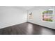 Bedroom with neutral paint, wood floors, two windows, and white trim at 773 Minor Oaks Nw Run, Lilburn, GA 30047