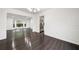 Elegant dining area with wainscoting, updated light fixture, and view into the kitchen at 773 Minor Oaks Nw Run, Lilburn, GA 30047