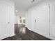 Inviting entryway with dark wood floors, white walls, and plenty of natural light at 773 Minor Oaks Nw Run, Lilburn, GA 30047