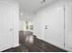 Bright entryway with a large double-door, light walls, and luxury vinyl plank flooring at 773 Minor Oaks Nw Run, Lilburn, GA 30047