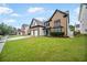 Beautiful two-story home with a well-maintained lawn, brick accents, and a two-car garage at 773 Minor Oaks Nw Run, Lilburn, GA 30047