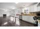 Open-concept kitchen and living room featuring hardwood floors and stainless appliances at 773 Minor Oaks Nw Run, Lilburn, GA 30047