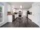 Updated kitchen with white cabinets, stainless steel appliances, and hardwood floors at 773 Minor Oaks Nw Run, Lilburn, GA 30047