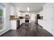 Updated kitchen features white cabinets, stainless appliances and hardwood flooring at 773 Minor Oaks Nw Run, Lilburn, GA 30047