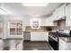 Modern kitchen with stainless steel appliances, granite countertops, and ample cabinet space at 773 Minor Oaks Nw Run, Lilburn, GA 30047