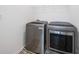This spacious laundry room contains modern washer and dryer units at 773 Minor Oaks Nw Run, Lilburn, GA 30047