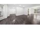 Spacious living room with hardwood floors, natural light and white trim throughout at 773 Minor Oaks Nw Run, Lilburn, GA 30047