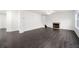 Spacious living room features luxury vinyl plank flooring and a cozy fireplace at 773 Minor Oaks Nw Run, Lilburn, GA 30047