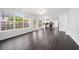 Open-concept living area with hardwood floors, lots of natural light, and access to the backyard at 773 Minor Oaks Nw Run, Lilburn, GA 30047