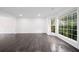 Bright living room with oversized windows, a view, and decorative molding is perfect for entertaining at 773 Minor Oaks Nw Run, Lilburn, GA 30047