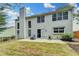 Rear exterior of the home with a well-maintained lawn and patio area at 12060 Carriage Park Ln, Duluth, GA 30097