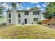Exterior of home showcasing the backyard, patio, and lush lawn with newly installed sod at 12060 Carriage Park Ln, Duluth, GA 30097