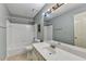 The bathroom features ample counter space, a bath tub, and updated fixtures at 12060 Carriage Park Ln, Duluth, GA 30097