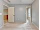 Spacious bedroom with plush carpet and multiple entryways at 12060 Carriage Park Ln, Duluth, GA 30097