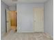 This bedroom features neutral walls and carpet, plus a door into an adjacent room at 12060 Carriage Park Ln, Duluth, GA 30097