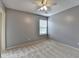 Neutral bedroom with plush carpet, ceiling fan, and bright window at 12060 Carriage Park Ln, Duluth, GA 30097