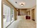 Open-concept dining area with tile floors and sliding door access to the backyard patio at 12060 Carriage Park Ln, Duluth, GA 30097