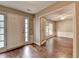 Open foyer showcasing hardwood floors with a view into the adjacent room at 12060 Carriage Park Ln, Duluth, GA 30097